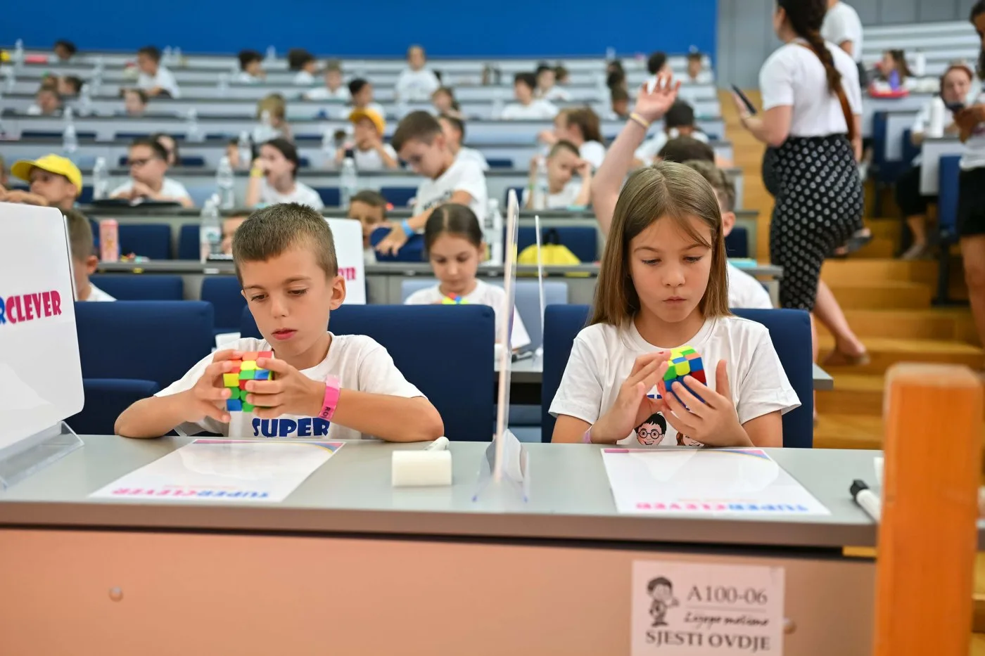 Children solving Rubik's cubes